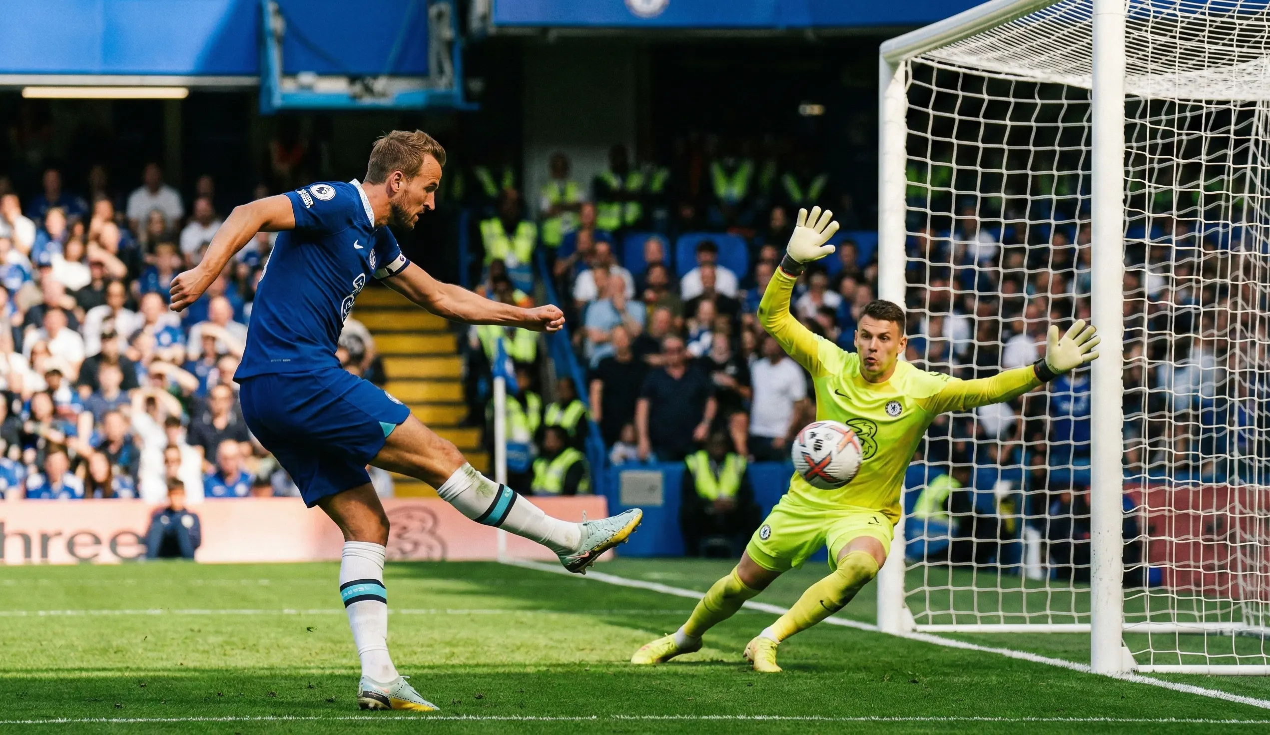 Football match action shot showing a striker attempting to score against a goalkeeper