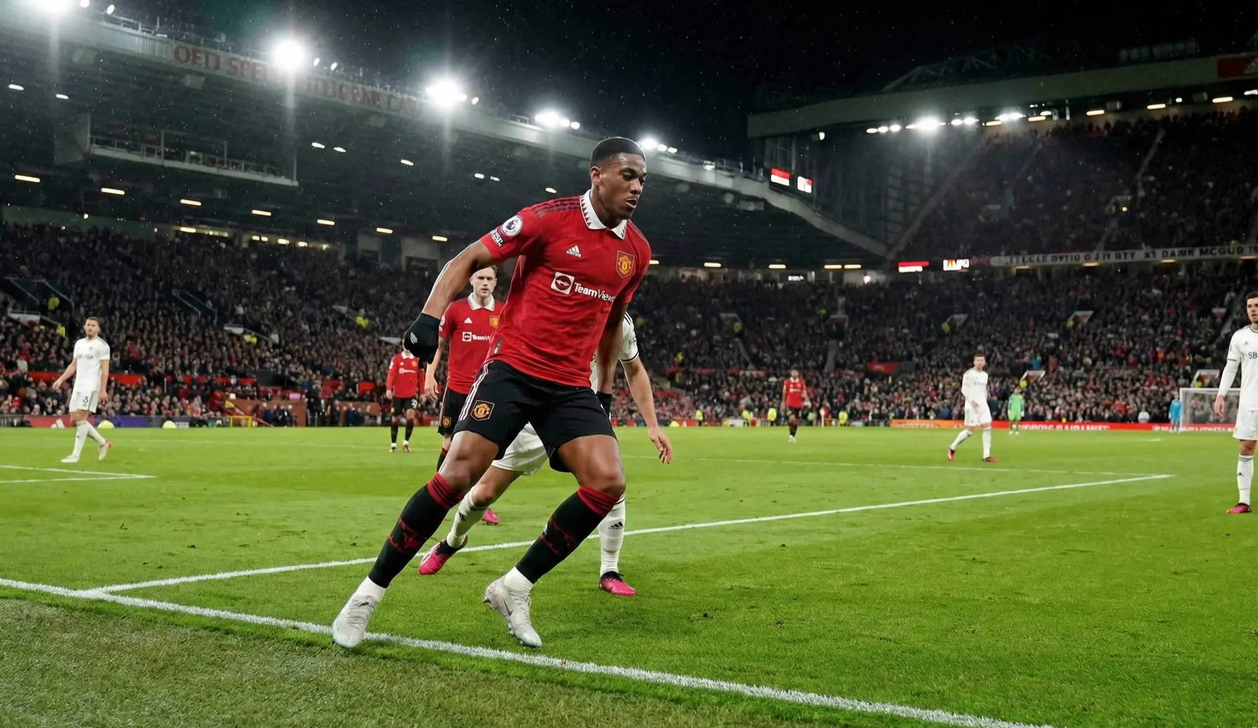 Football striker positioned inside the penalty area waiting for a cross